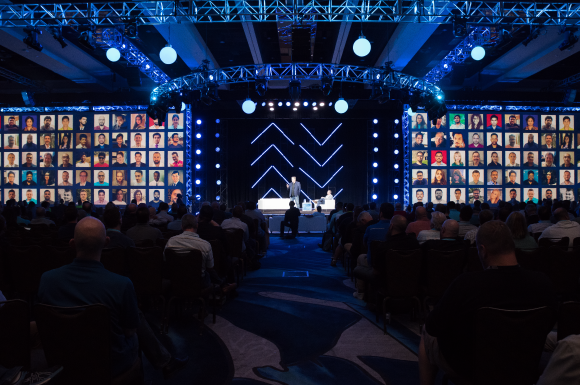 A man onstage at IT Nation giving a presentation