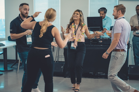 Four ConnectWise employees dancing at a party