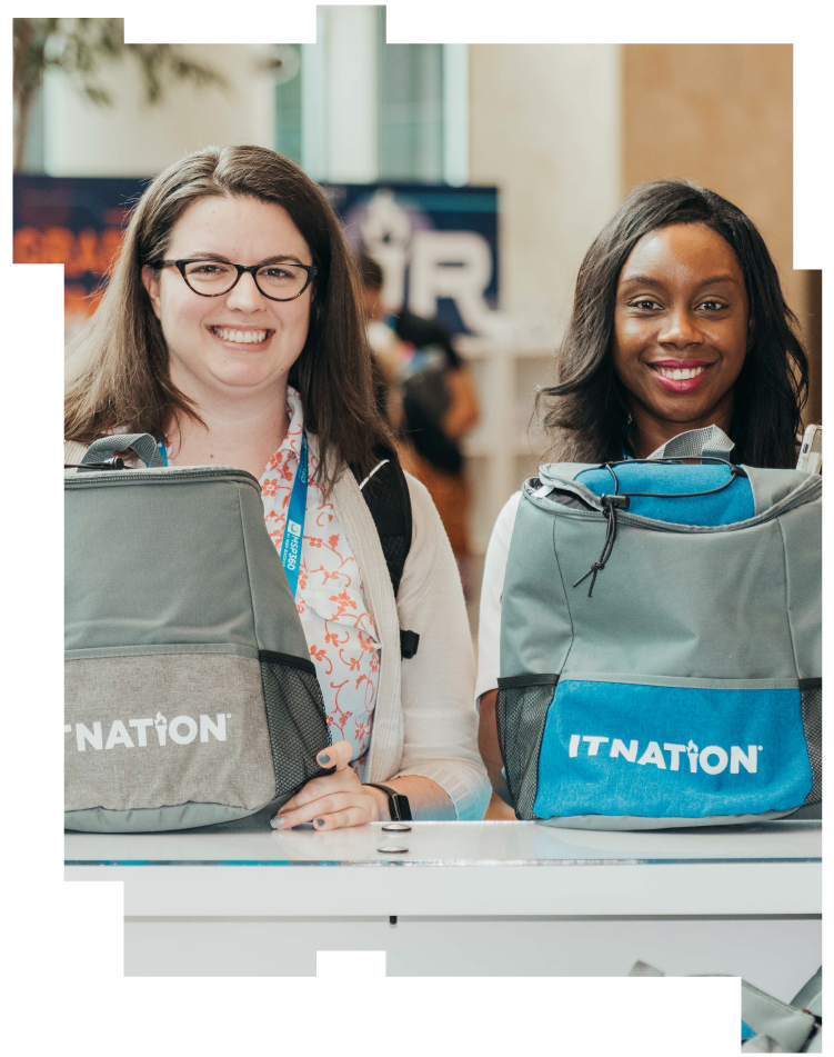 Two smiling women with ConnectWise IT Nation backpacks