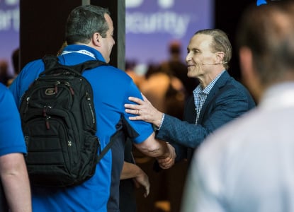 ConnectWise cofounder Arnie Bellini shaking hands with a partner